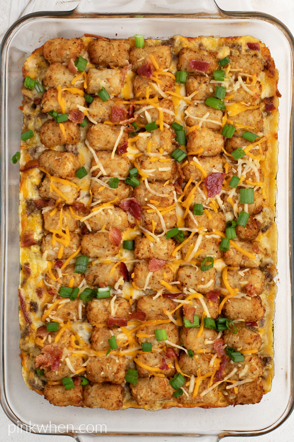 Overhead shot of the bacon cheeseburger tater tot casserole in a dish, ready to serve. 