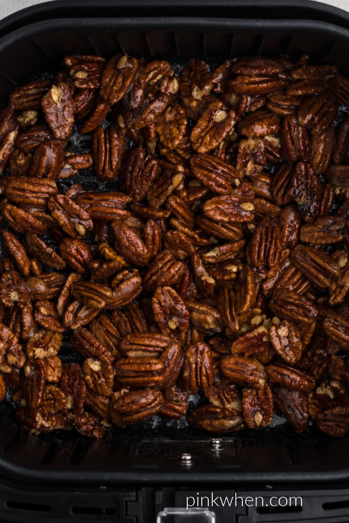 Candied pecans in the air fryer ready to cook. 