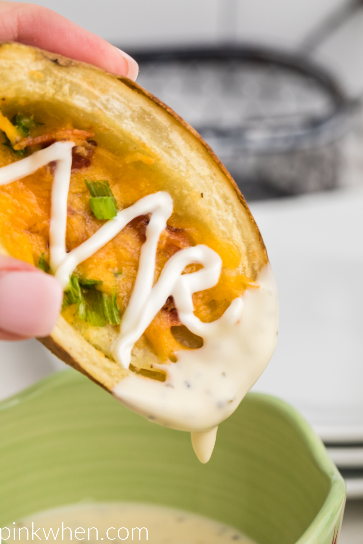 Air Fryer Potato skin with sour cream dipped in ranch dressing. 