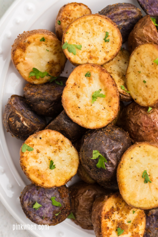 up close photo of air fryer roasted potatoes seasoned and ready to eat. 
