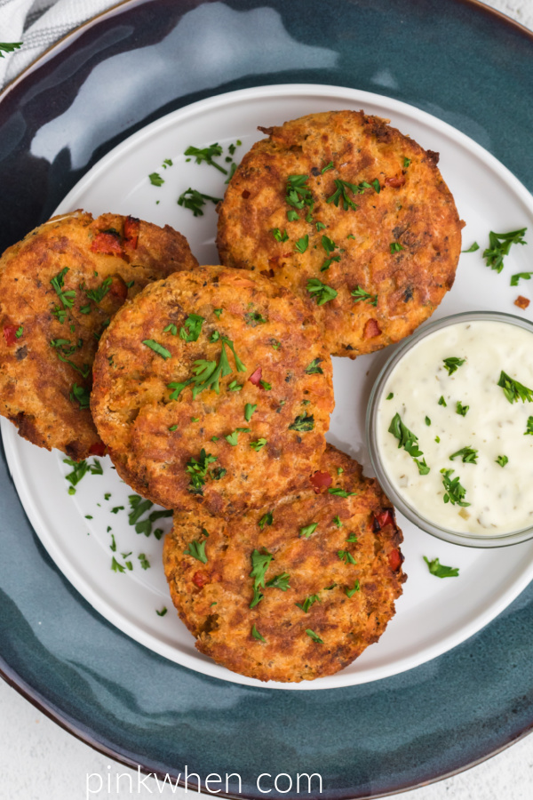 Overhead shot of air fryer salmon patties ready to serve. 