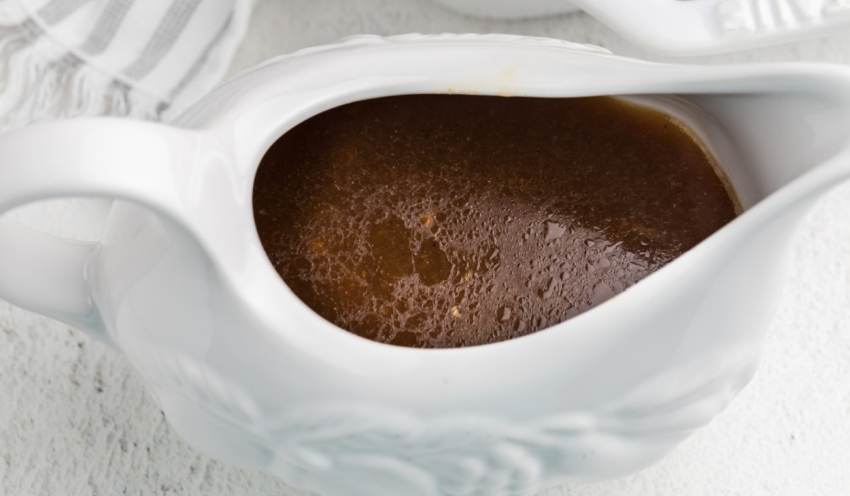 Gravy made from the drippings of the Instant Pot Tri Tip and placed into a gravy boat. 