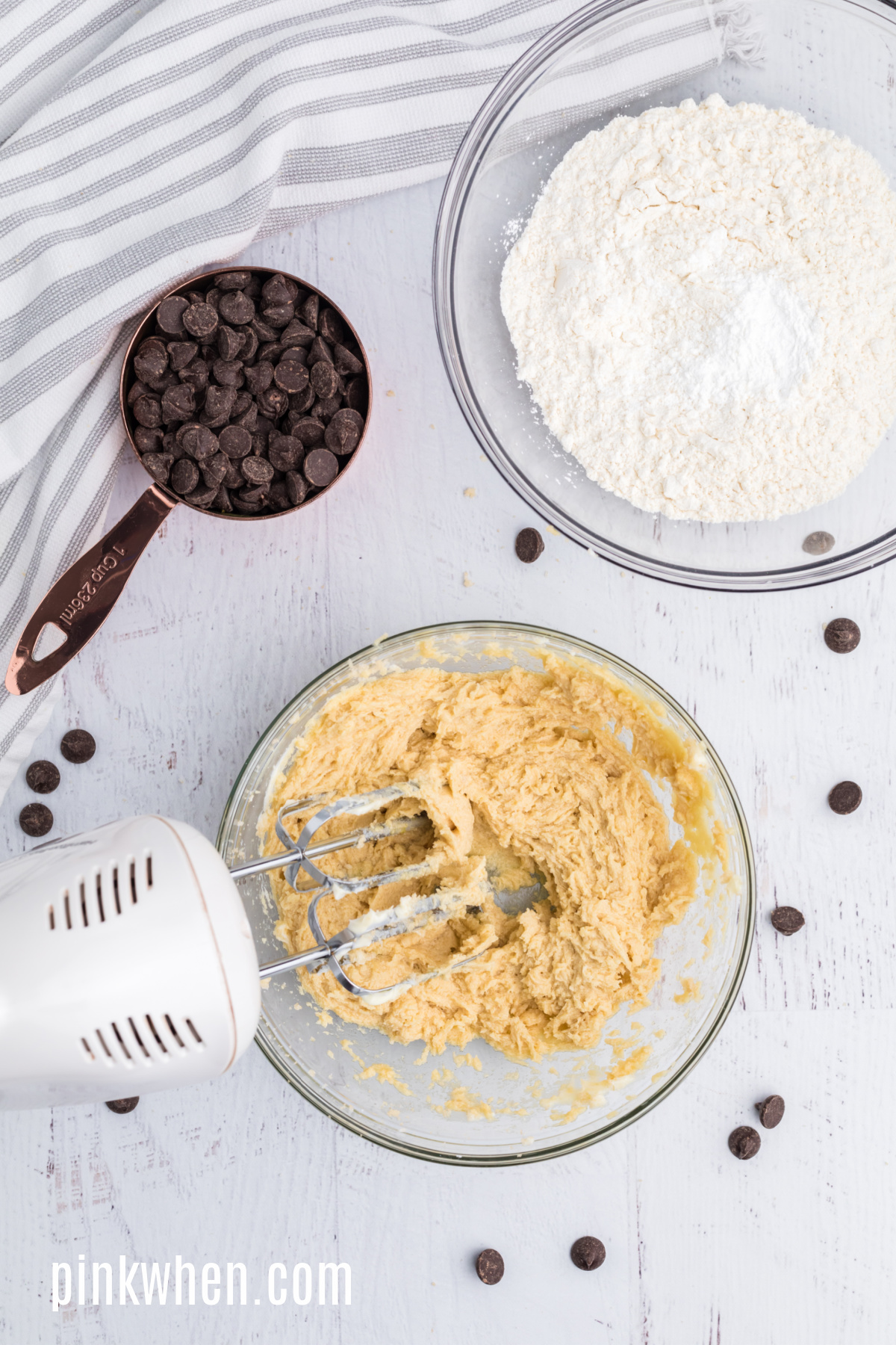 Butter, sugars, egg, and vanilla creamed together in a mixing bowl.