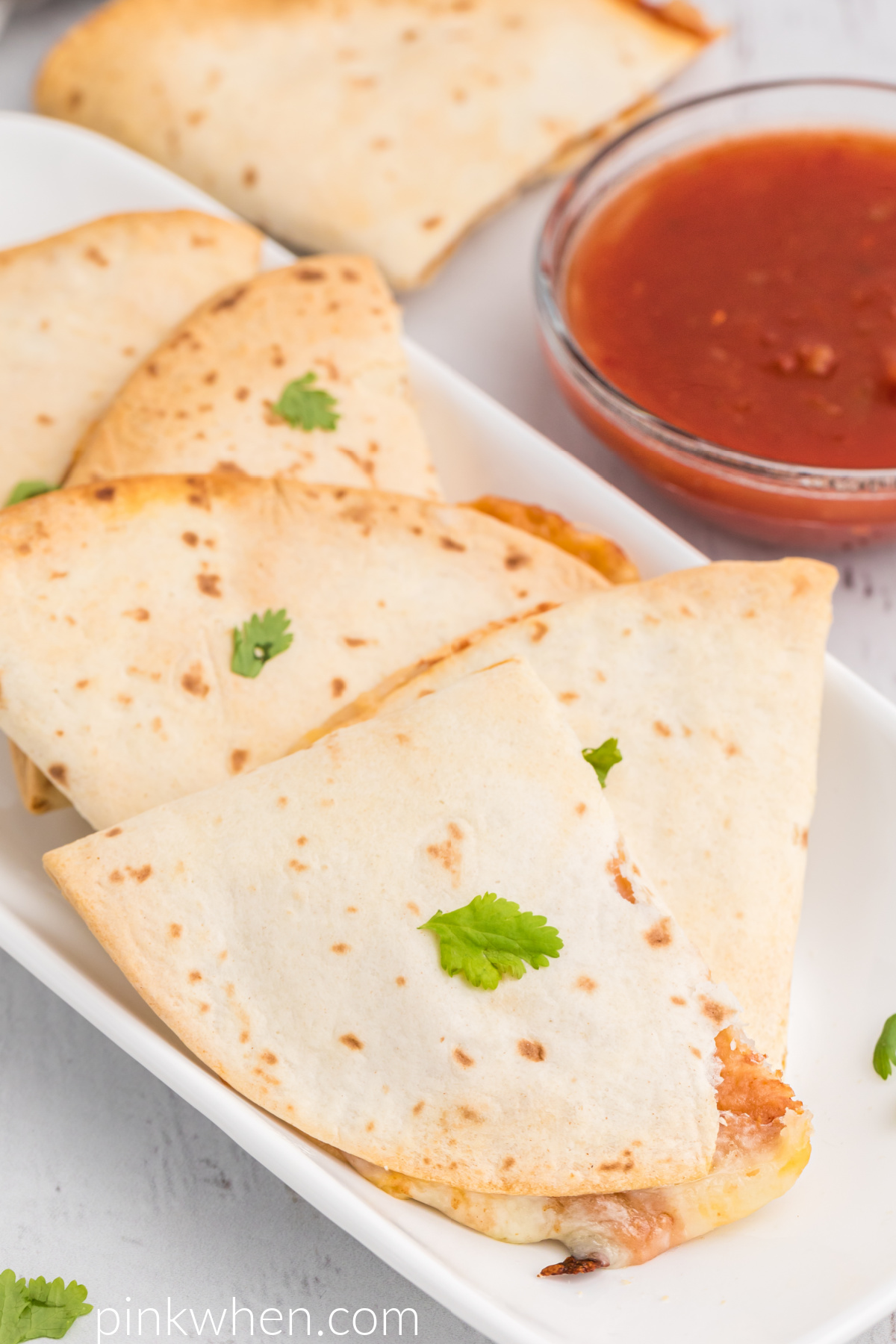 Fully cooked Air Fryer Quesadillas on a plate and ready to eat. 