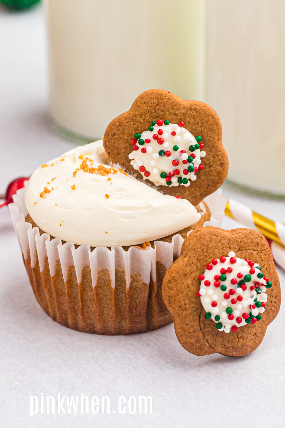 Gingerbread cupcakes with cream cheese frosting and topped with a cookie before serving. 