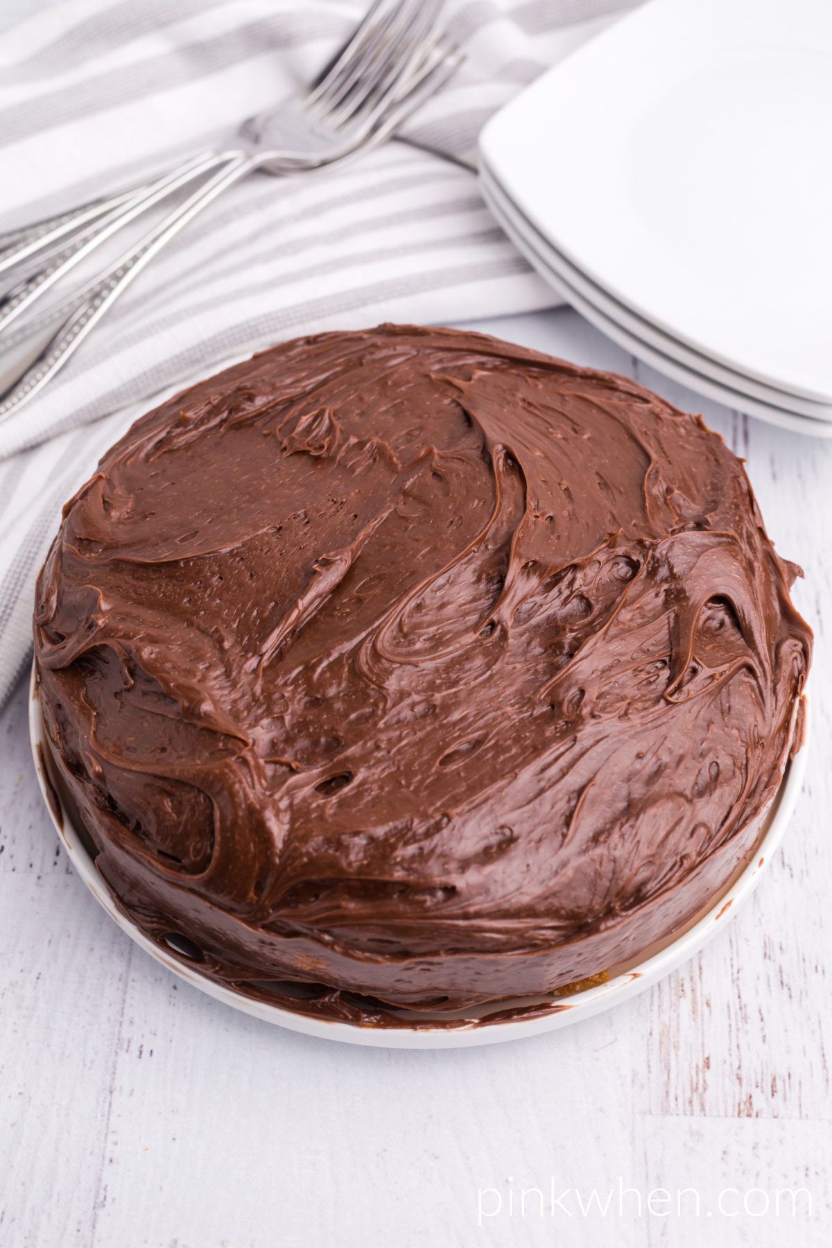 Chocolate frosting covered cake that was made in the air fryer. 