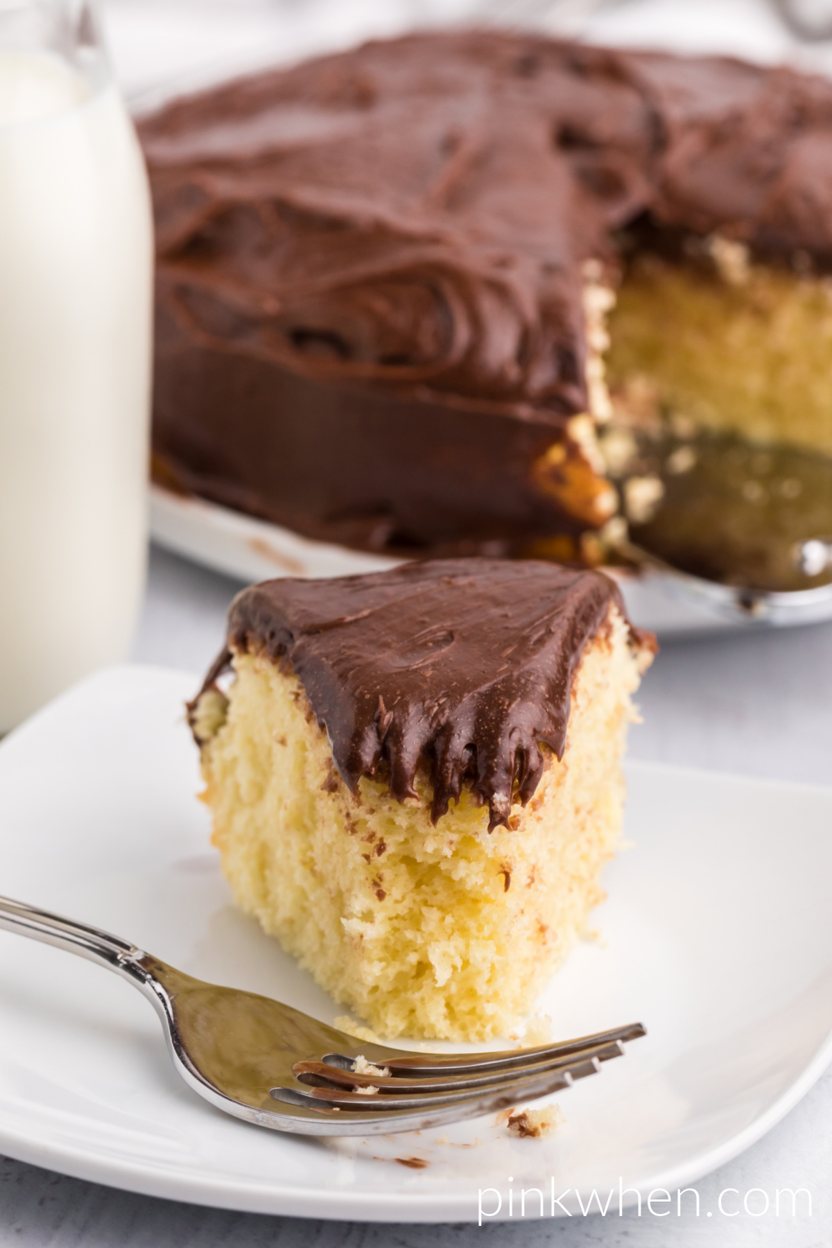 Slice of cake that was made in the air fryer, with a bite missing. 