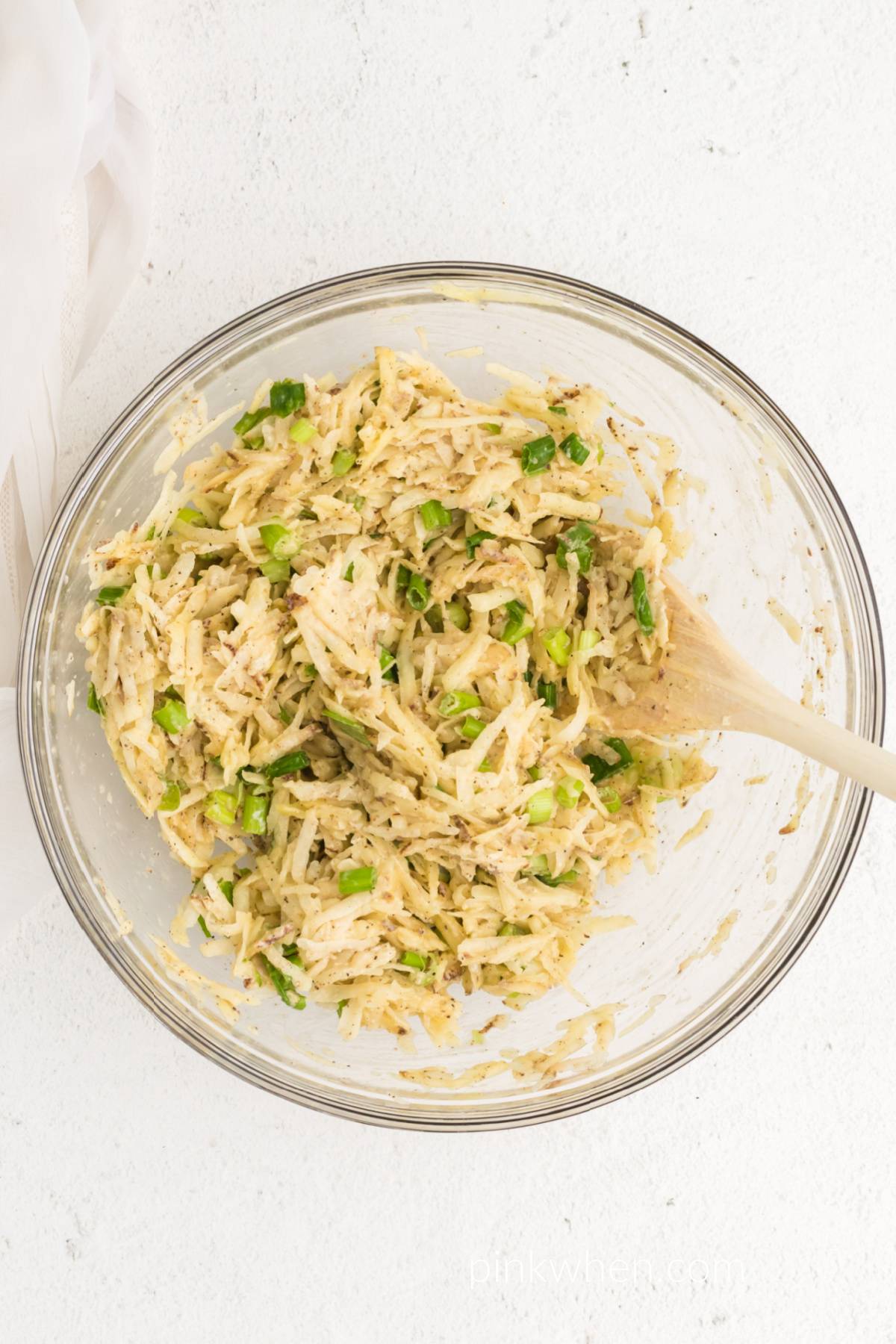 Potato fritter mixture in a bowl.