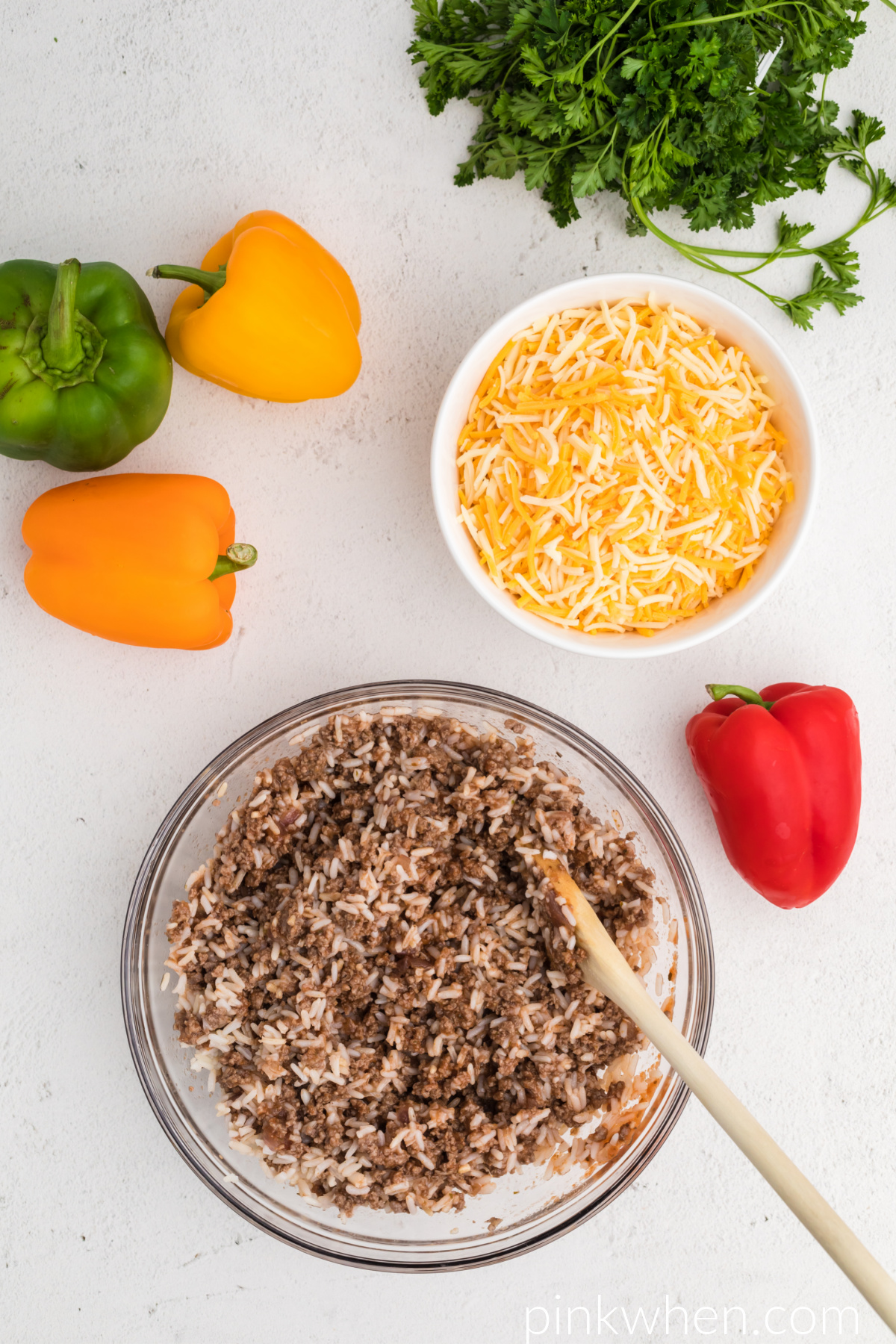 Rice and meat mixture on a bowl before being stuffed into peppers. 