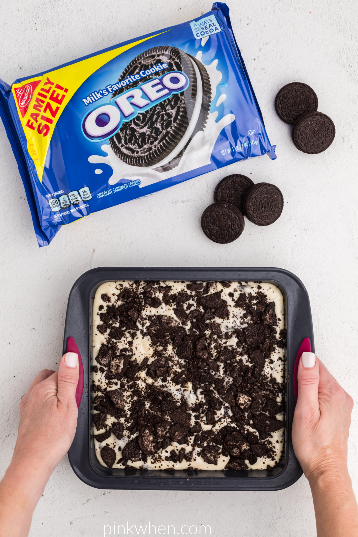 OREO fudge in a silicone dish ready to be cooled and hardened in the refrigerator. 