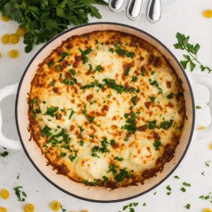 Overhead shot of one pot lasagna and shells topped with fresh parsley.