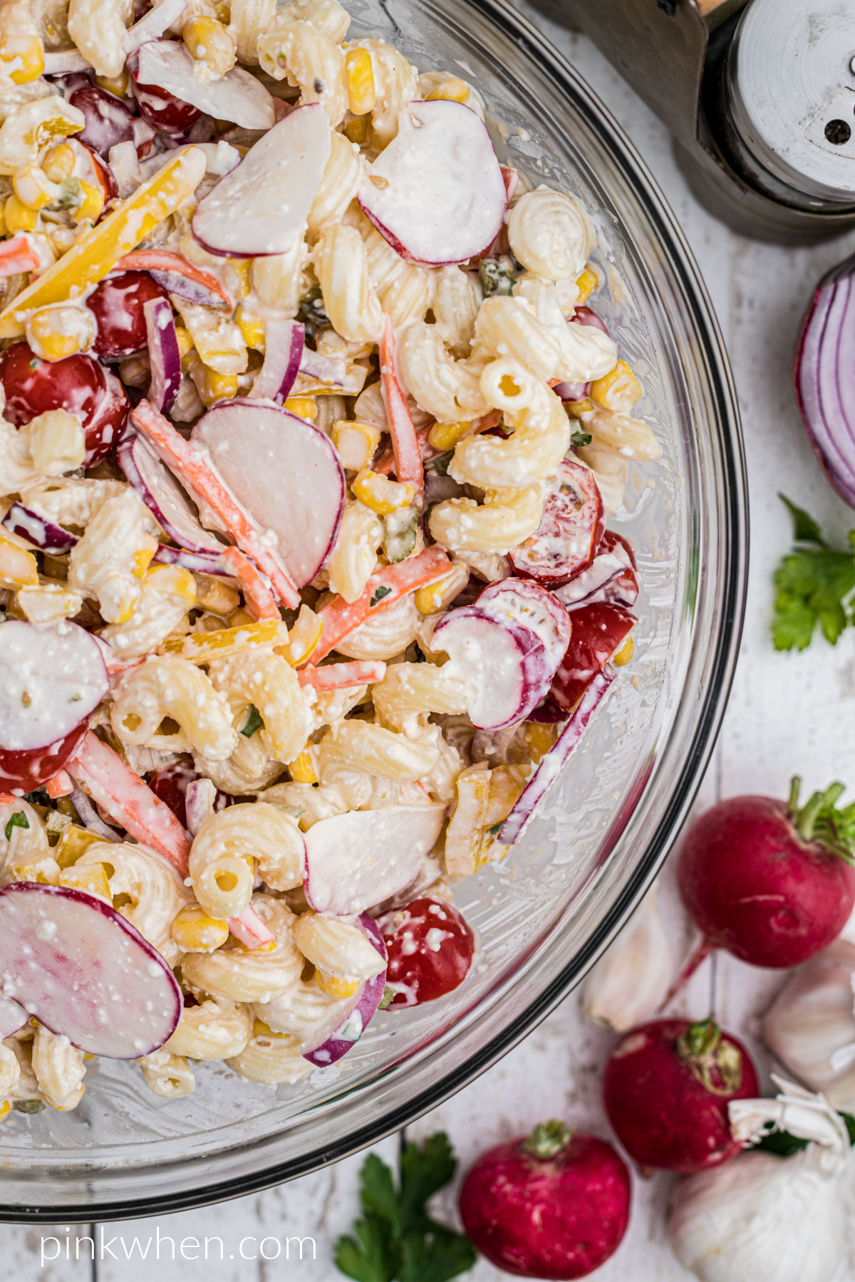 Close up shot of delicious summer pasta salad in a bowl and ready to serve.