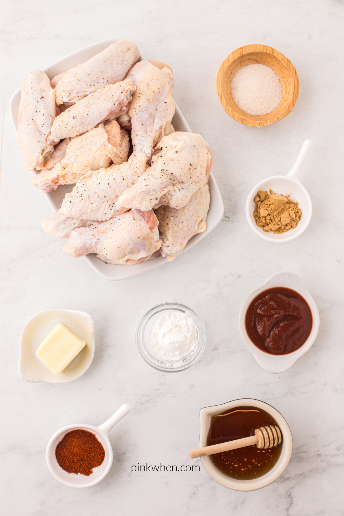 Ingredients to make honey sriracha wings on a table.