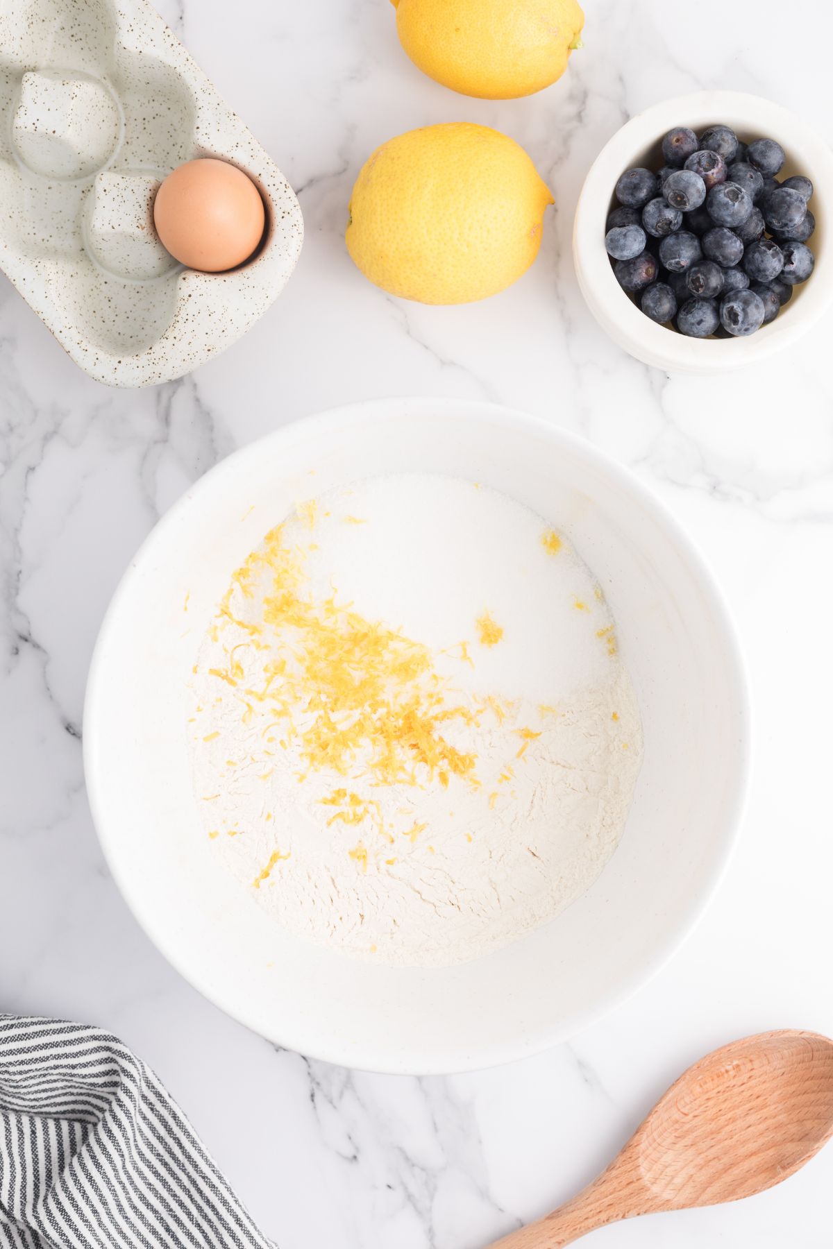 Dry ingredients being mixed in a white bowl