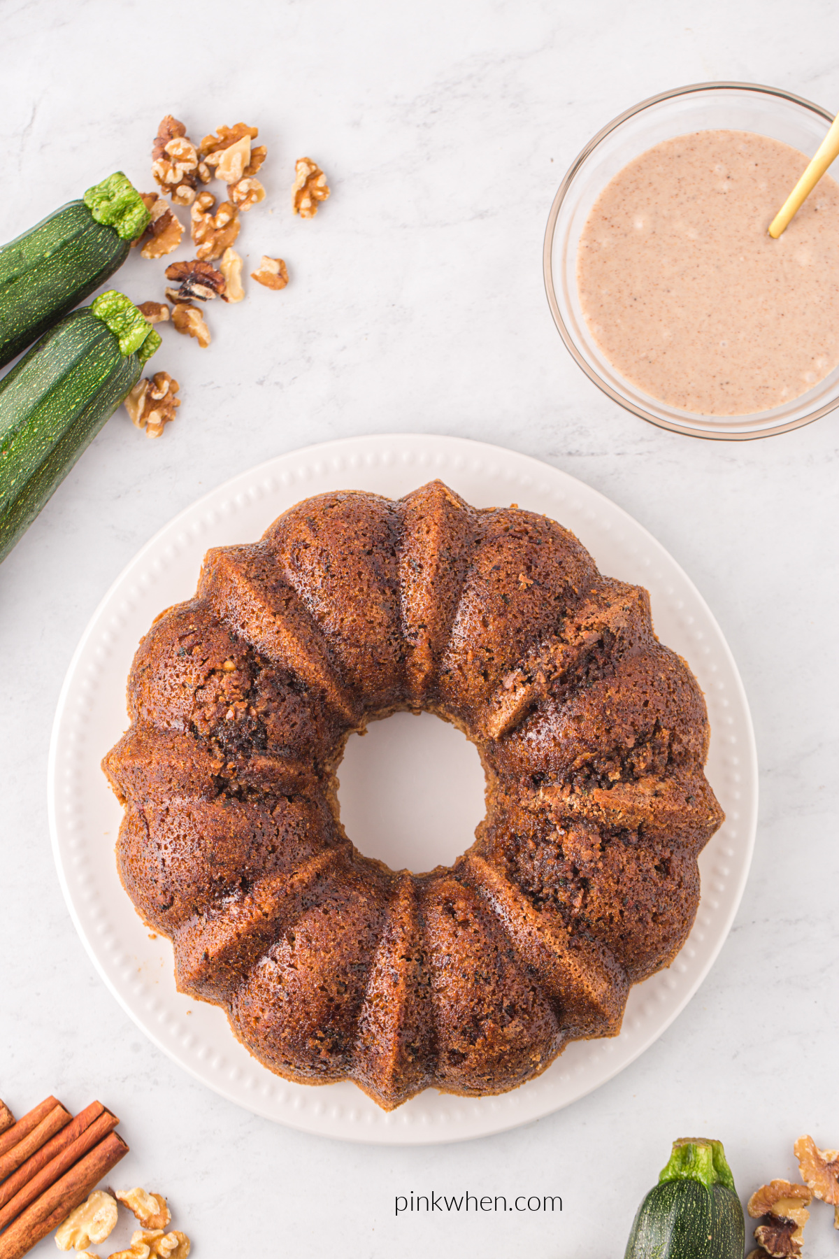 Zucchini cake on a plate, ready to be covered in icing.