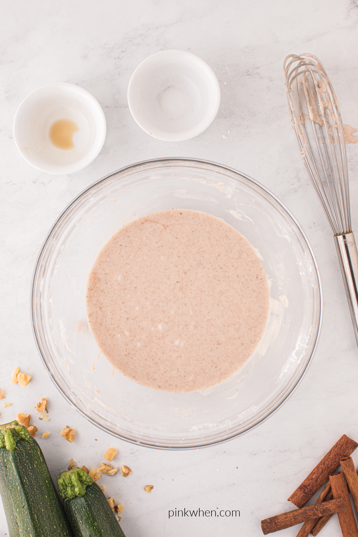 Cinnamon icing mixed in a bowl. ready to be poured over a cake.