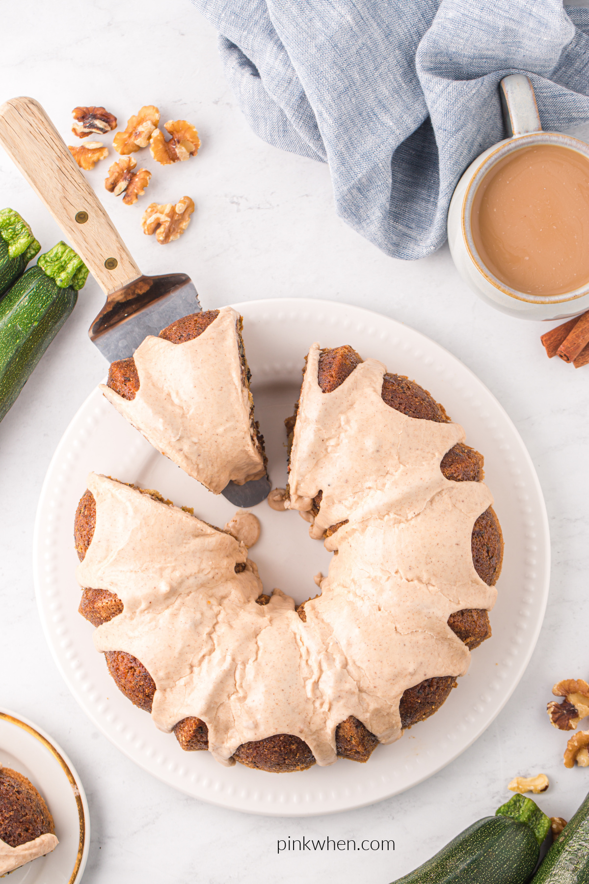 Overhead shot of zucchini bundt cake sliced and ready to serve.