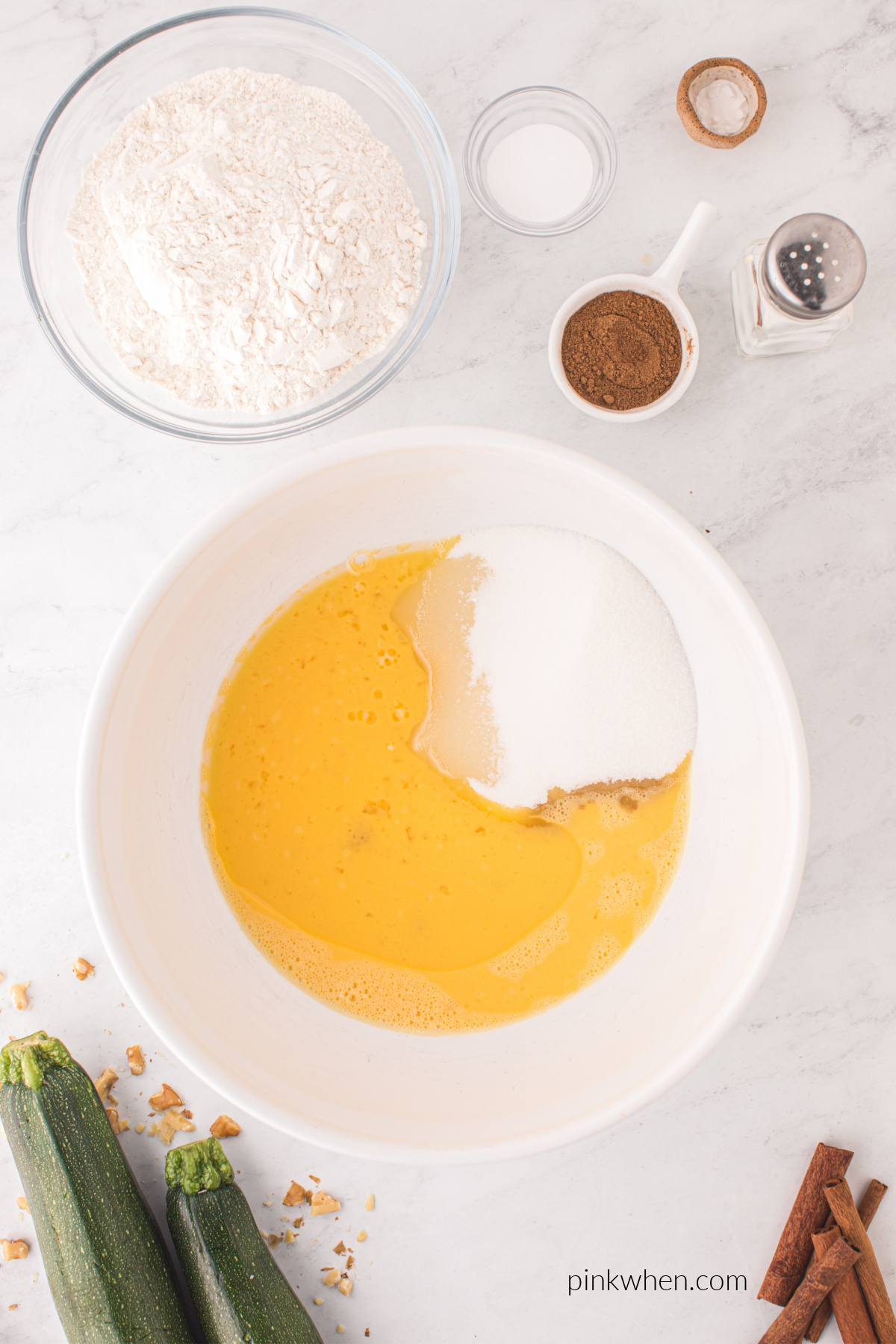 egg and sugar, oil, and vanilla in a mixing bowl.