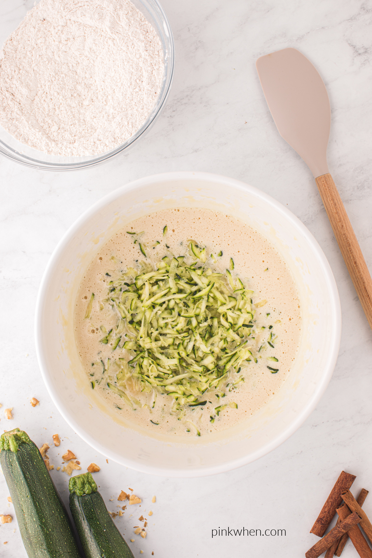 Zucchini added to the cake batter.