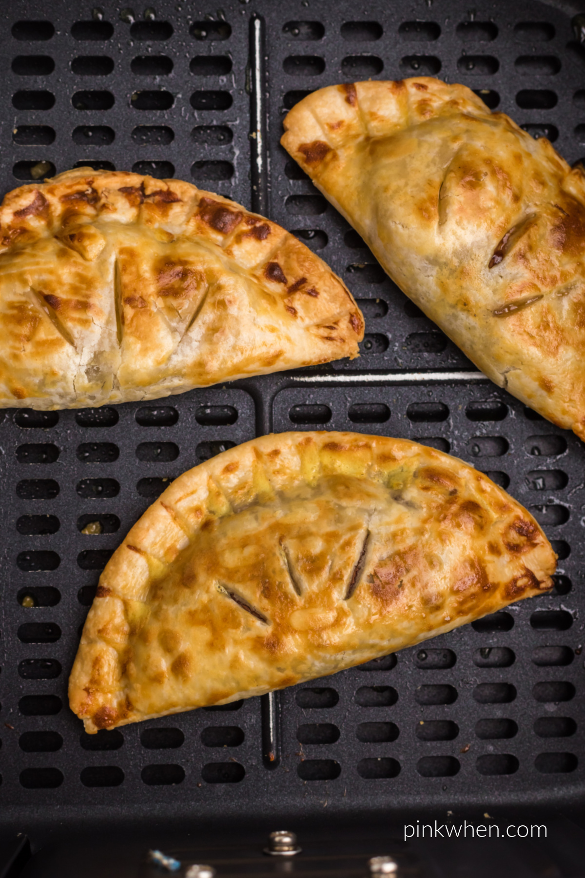 Air fryer banana Nutella hand pies in the basket, ready to be served.