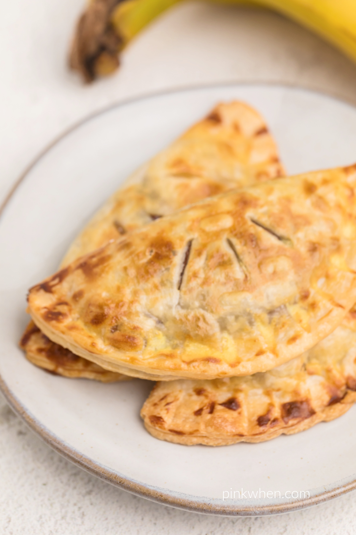 Air fryer banana Nutella hand pies served on a plate and ready to eat.