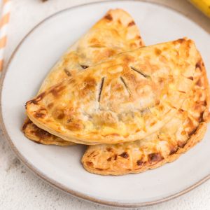 Banana Nutella hand pies made in the air fryer and served on a white plate.