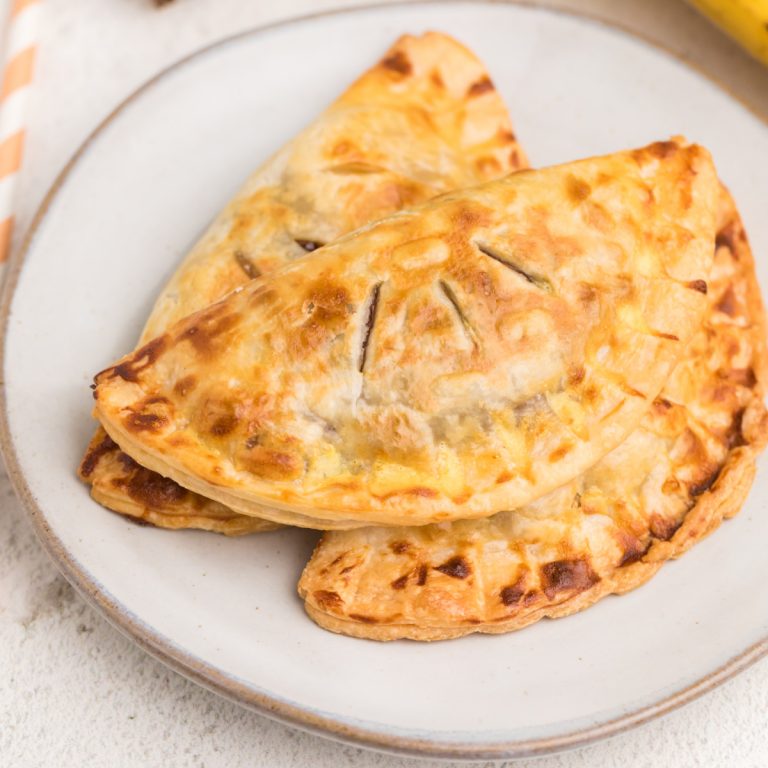 Banana Nutella hand pies made in the air fryer and served on a white plate.