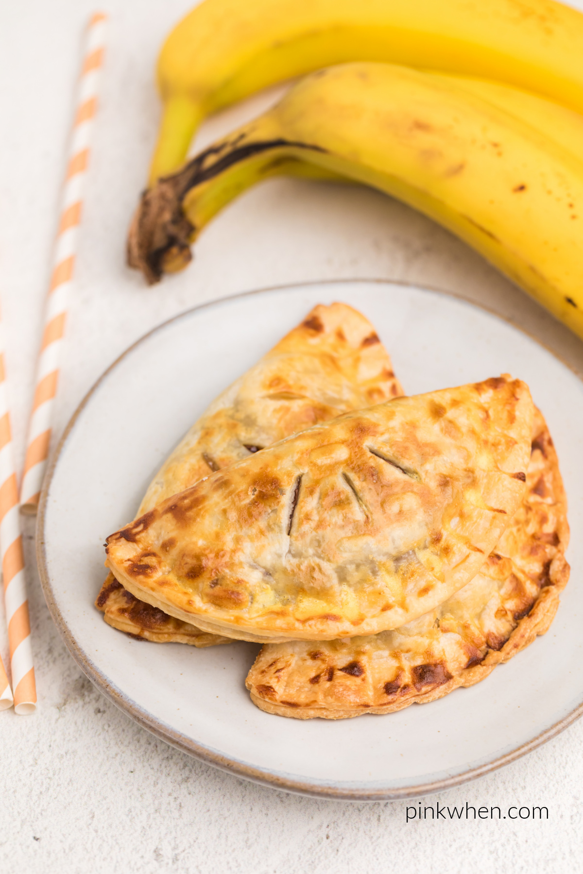 Air fried banana Nutella hand pies on a plate, ready to eat.