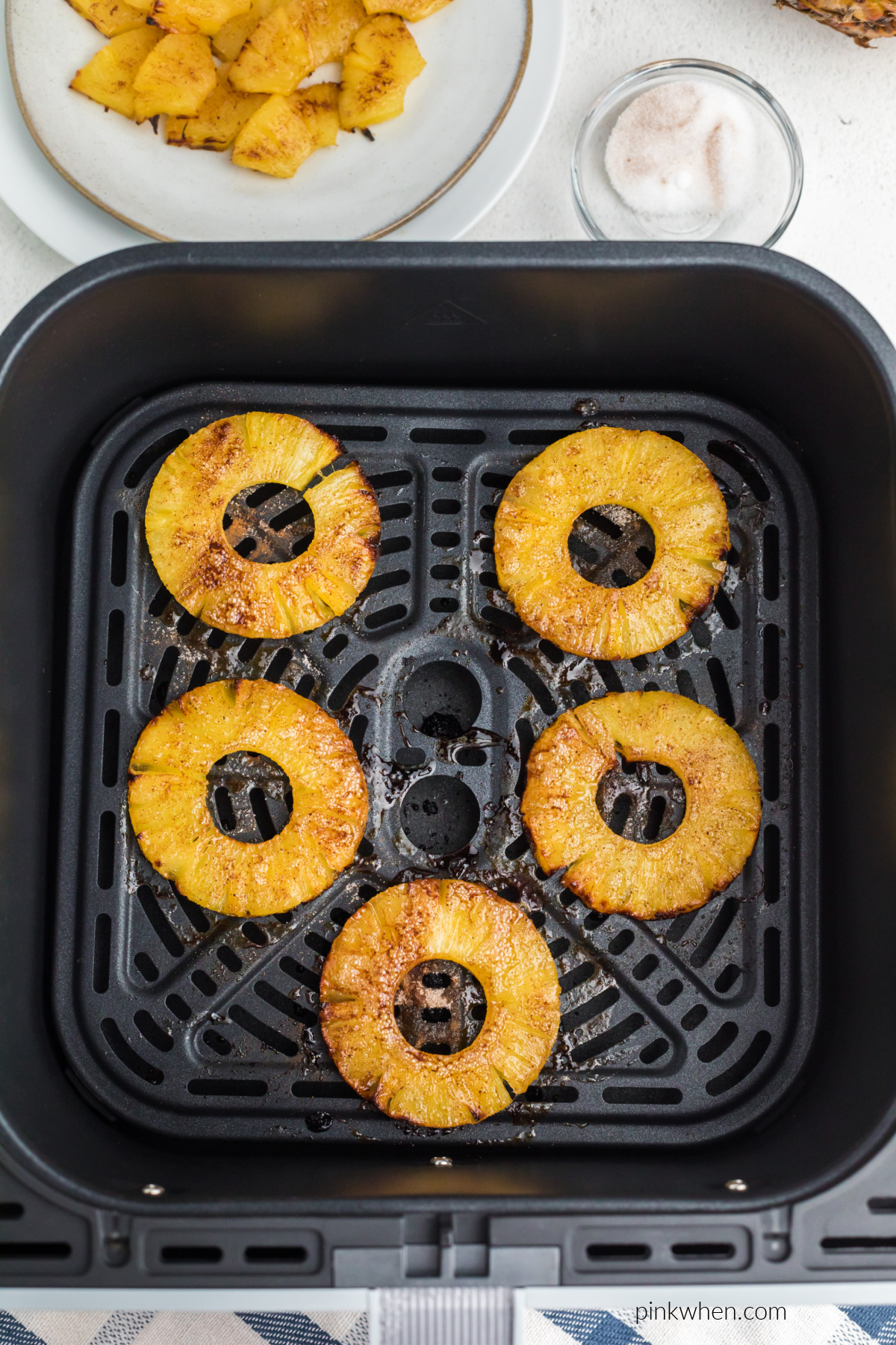 Pineapple rings sprinkled with cinnamon and sugar and air fried. 