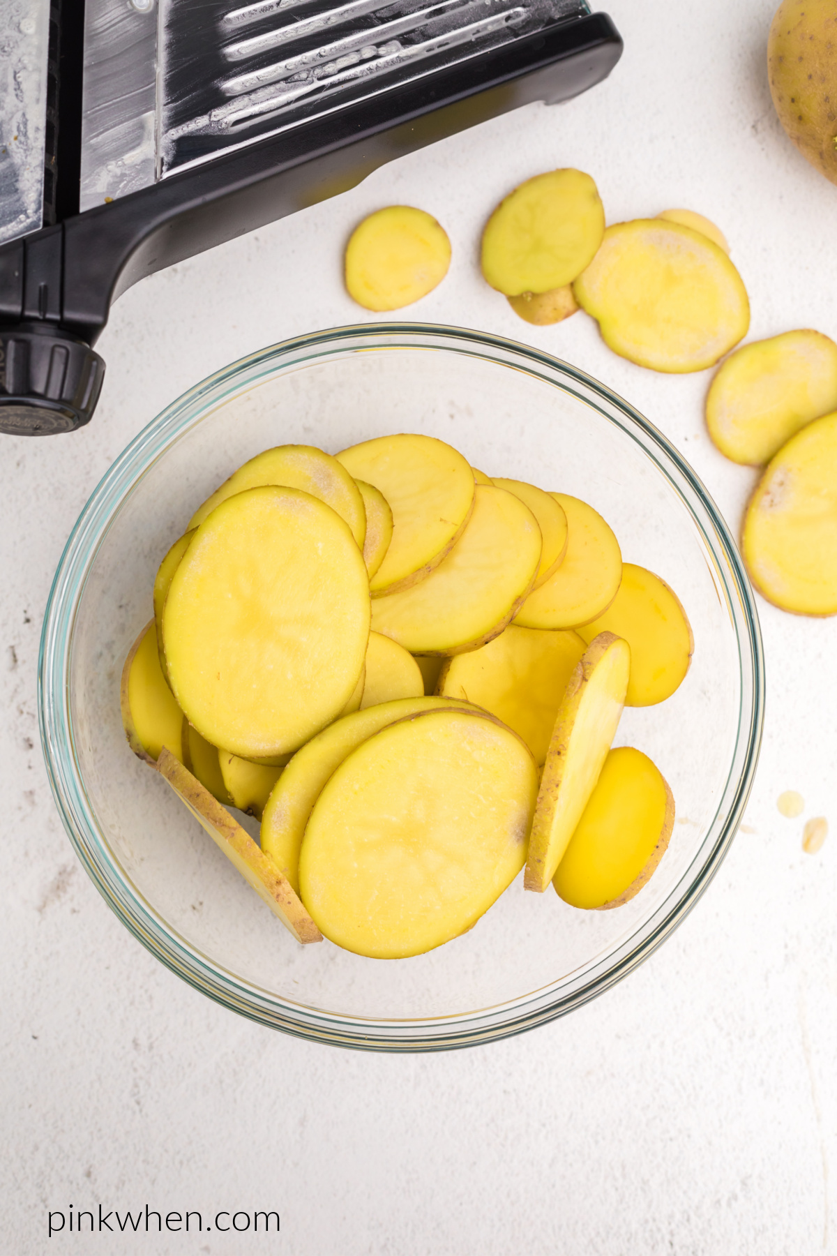 Sliced potatoes in a bowl.