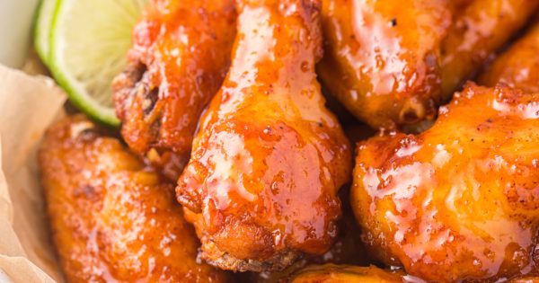 Sticky chicken wings with slice of lime.
