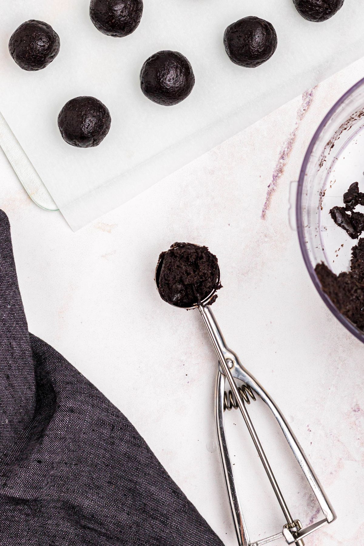 Crushed Oreo cookies mixed with cream cheese scooped and rolled into balls. 