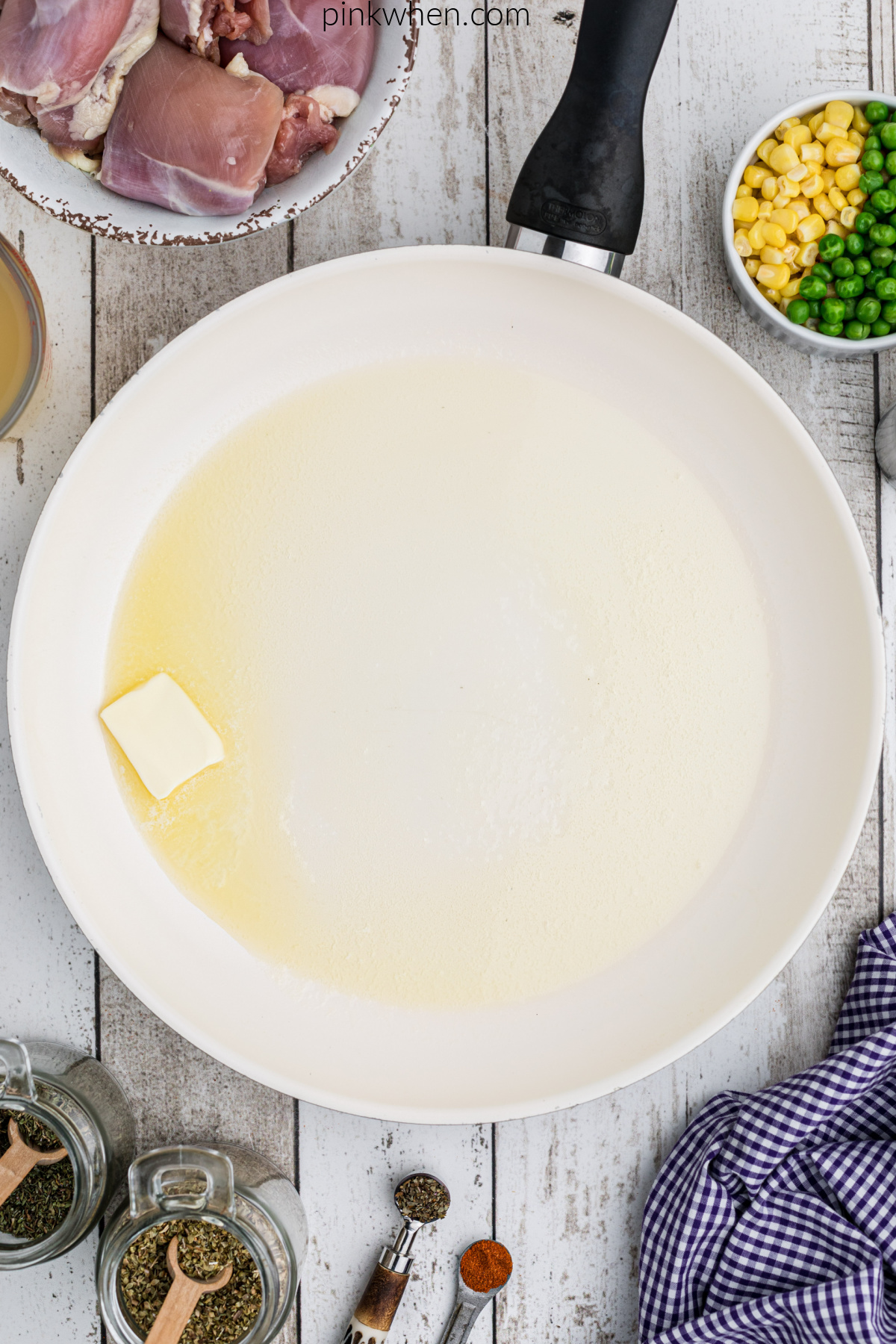 Butter being melted in a skillet.