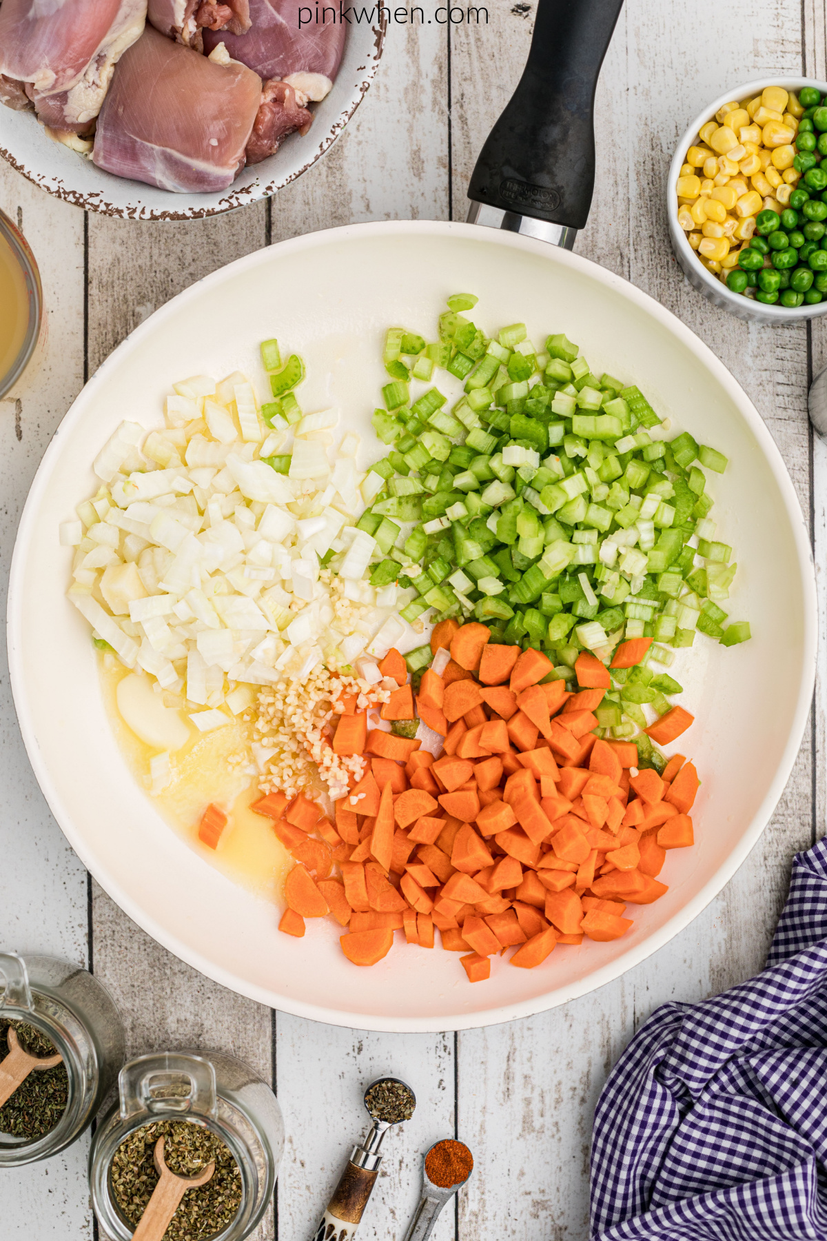 Vegetables added to the skillet with butter.