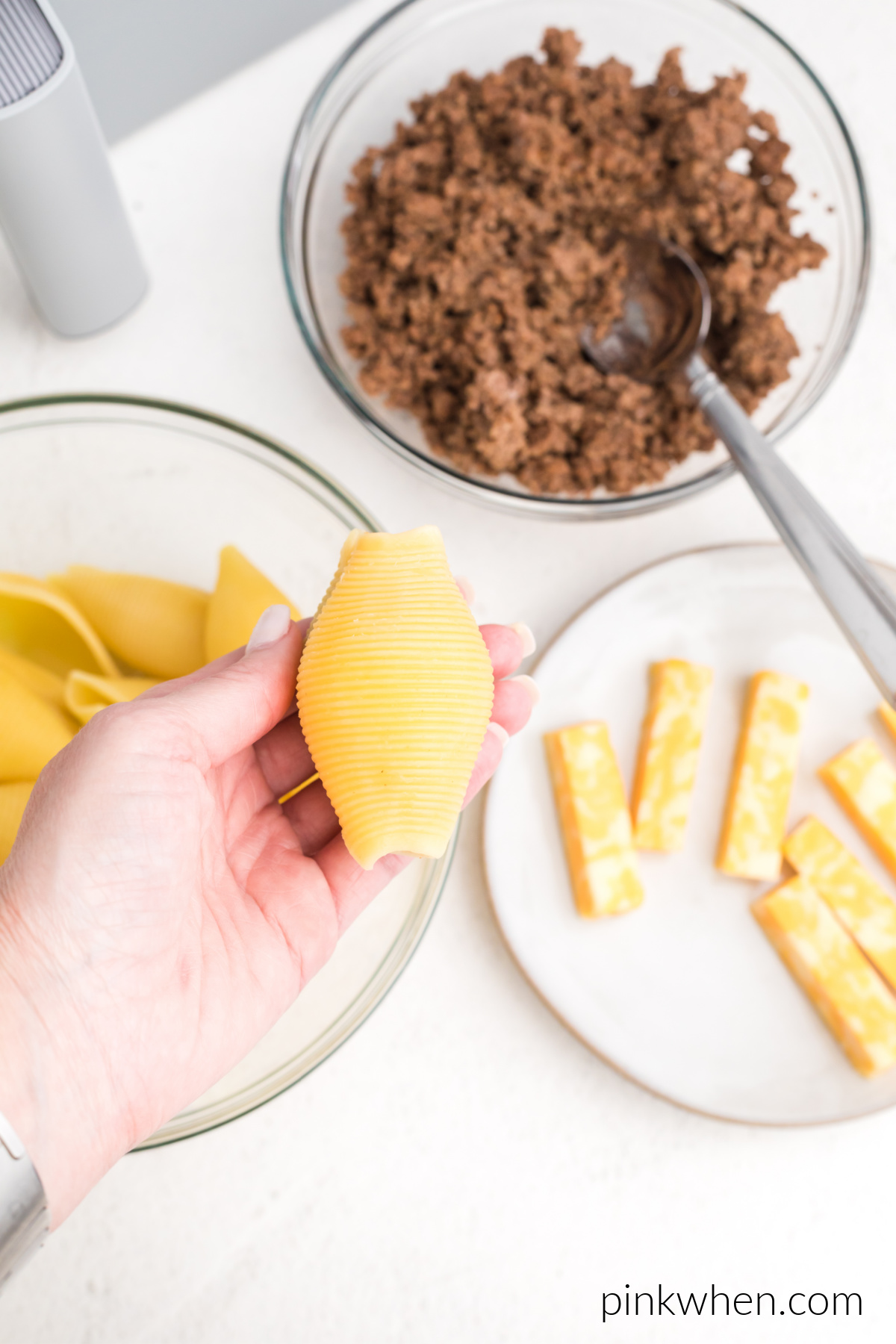 Stuffed shell topped with an additional shell to cover the cheese and taco meat mixture.
