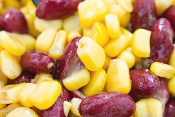 A close-up shot of corn and bean salad. 