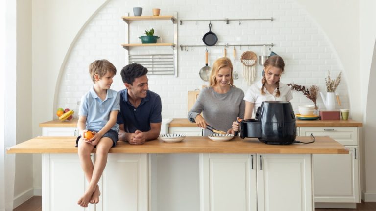 Family making breakfast with the air fryer together.