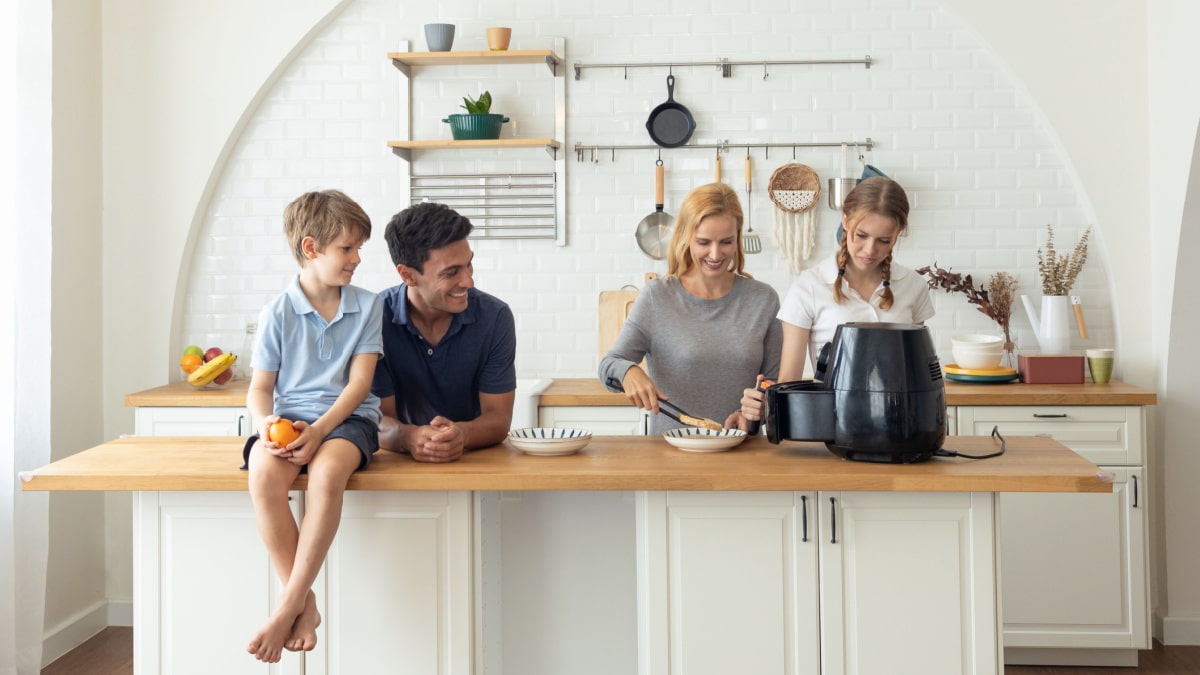 Family making breakfast with the air fryer together.