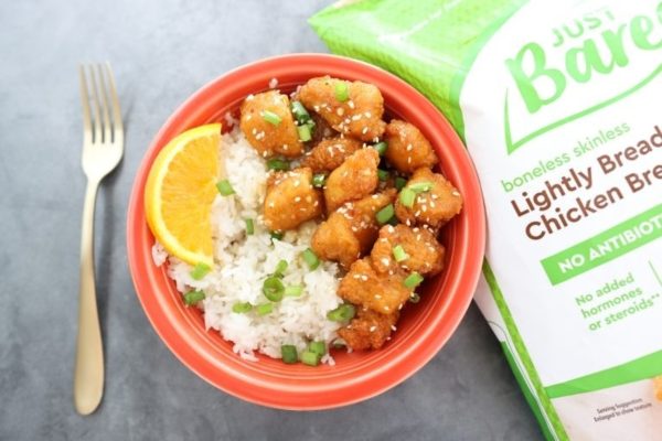 Air fryer orange chicken in an orange bowl.