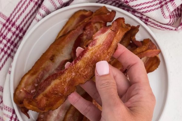 Bacon strips cooked in an air fryer.