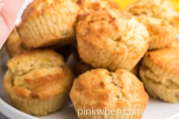 Air Fryer Banana Muffins stacked together on a serving dish.