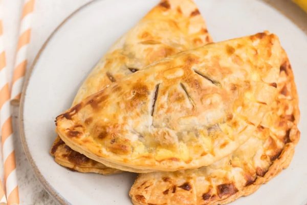 Air Fryer Banana Nutella Hand Pies on a white plate.