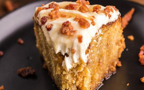 A slice of Air fryer cornbread cake on a black plate