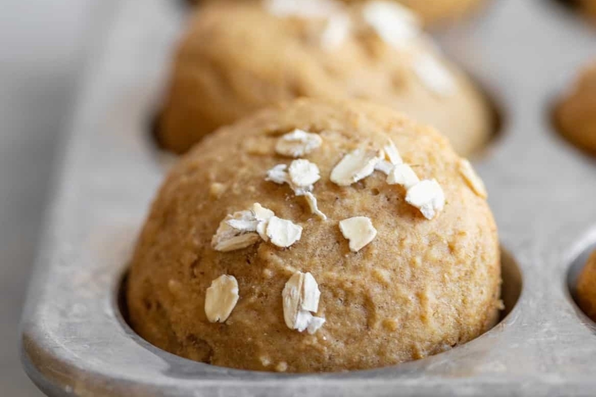 Applesauce muffins in a baking tray.