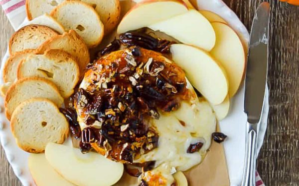 Gooey brie with fig jam and crackers on the side.