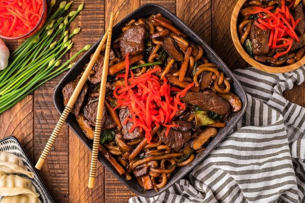 Beef Yaki Udon Noodle Stir Fry served on a square plate.