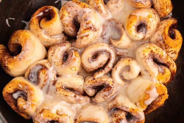Biscuit cinnamon rolls in a black dish. 