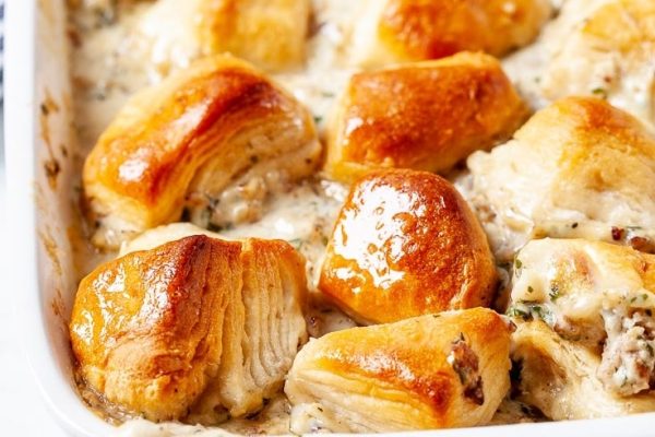 Biscuits and gravy casserole in a white serving dish. 