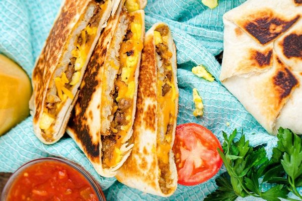 Breakfast quesadillas on a blue towel.