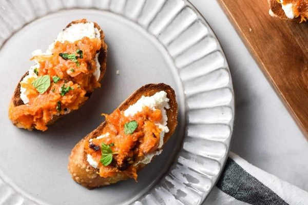 Two crostini on a plate.